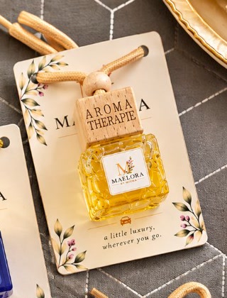 Maelora golden glass hanging car fragrance on a gift card
