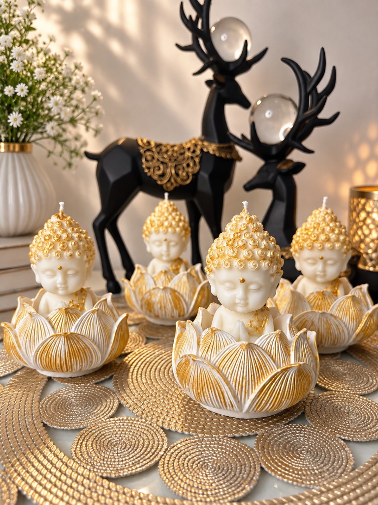 Lotus Buddha Candles by Maelora styled with gold mats, flowers and festive décor