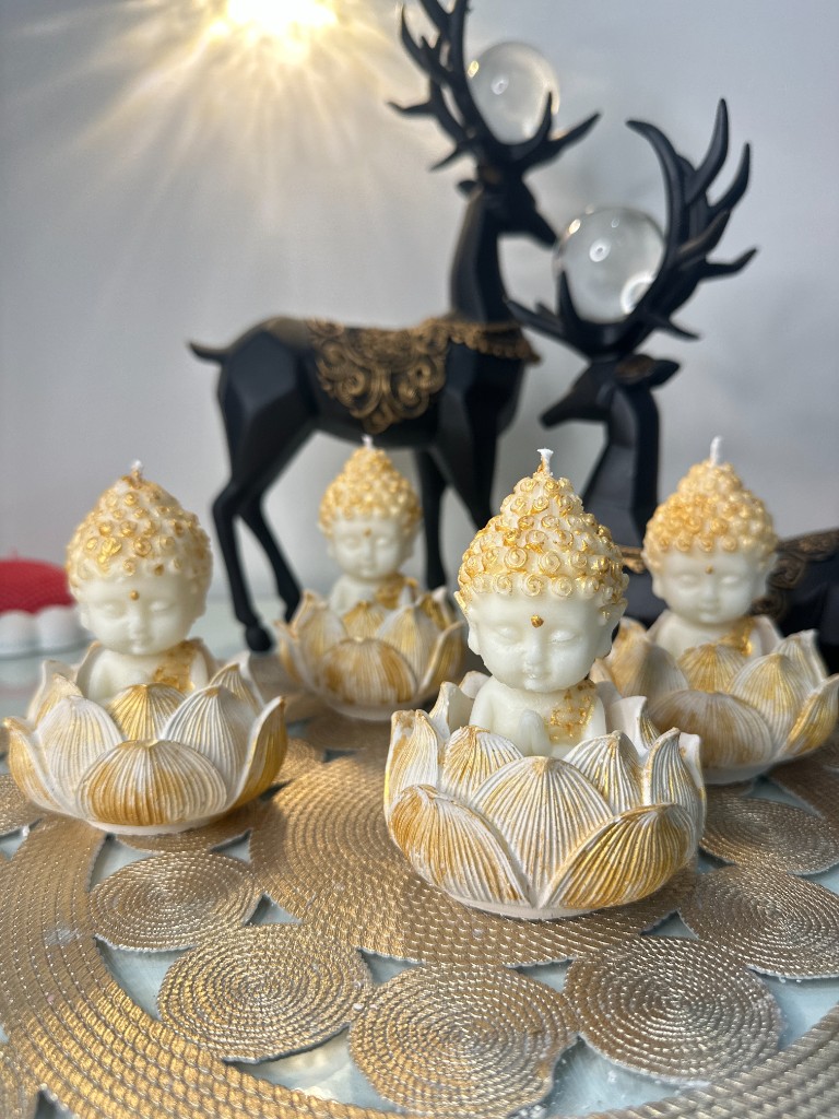 Handcrafted lotus Buddha candles by Maelora By Misha with gold petal accents